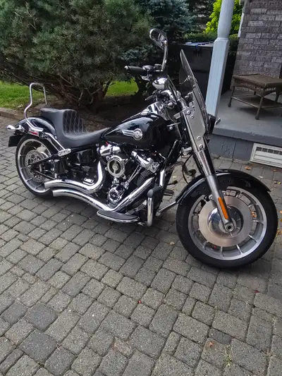 Meticulously maintained 2022 Harley Davison Fatboy that runs as incredible as it looks..Upgraded Van...