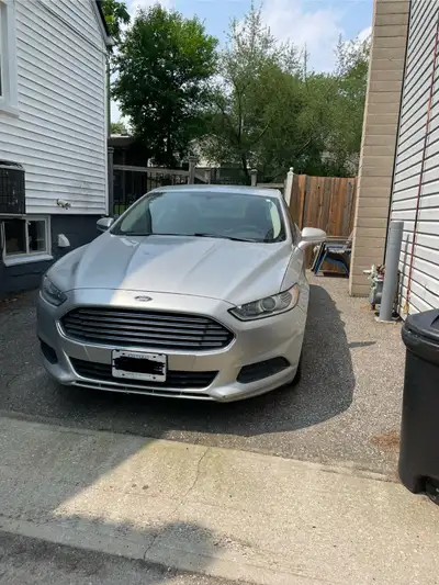 Silver 2013 2.5 4cyl. Ford Fusion in great working condition. 170,000km. Selling as is. New steering...