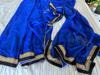 Blue saree with black and gold border