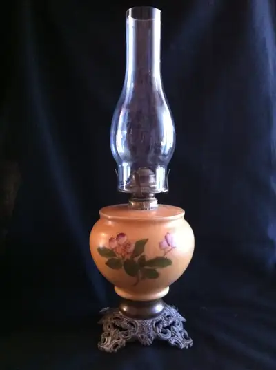 A BEAUTIFUL HAND PAINTED OIL LAMP MADE OF MILK GLASS. IT IS IN PERFECT WORKING CONDITION THE WICK GO...