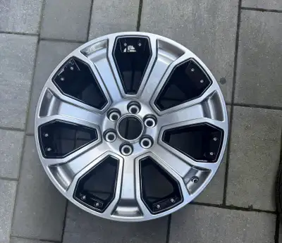 Single. 22x9 inch aluminum 7 spoke wheel with silver and black inserts. Genuine General Motors Facto...