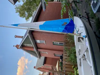 CL14 sailboat has new jib sail only used once. Trailer has brand new rims and tires (Aug-Sept this y...