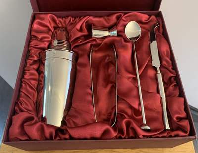 This five-piece stainless steel cocktail set includes a: - cocktail shaker - double measuring jigger...