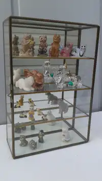 Cat miniature collection in a display case