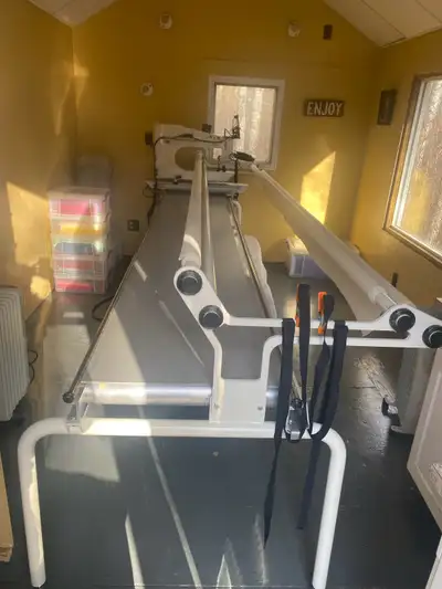 2015 APQS Lenni longarm quilting machine with QuiltPath computerized system and 12’ table. This mach...