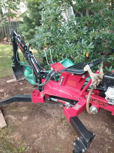 Princess Auto towable excavator used about 10 hours. I pulled a few stones and dug out some large bu...