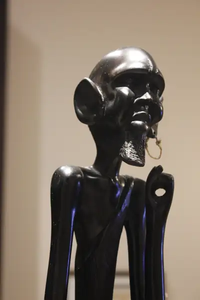 Wood carving:   African hunter, View more