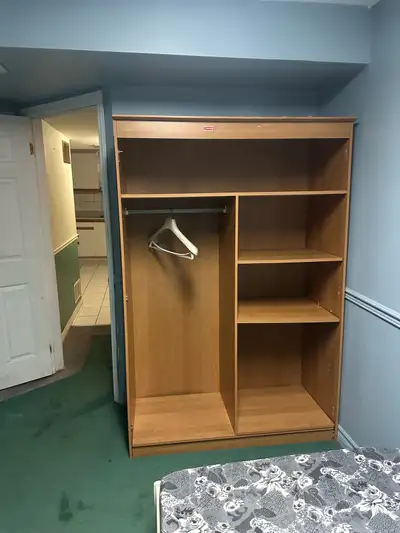 I am offering a sharing room for a female, featuring a spacious wardrobe with ample shelving and han...