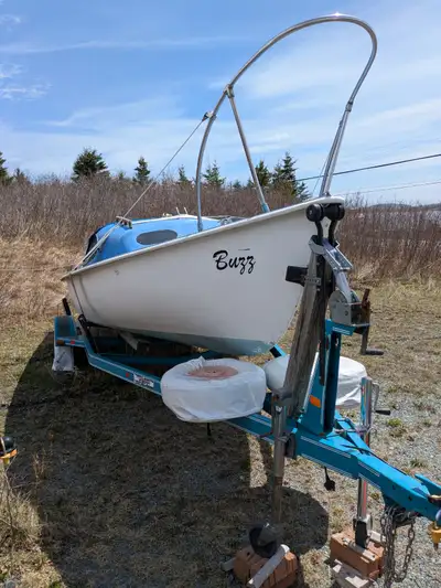 Sailboat and Trailer (sailboat has no mast) 20 feet. MFG FORD 20. Trailer 2007. If the ad is up, the...