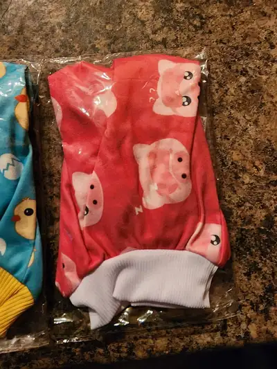 I have 4 outfits for a little dog. They are all size small but they are to small for my she-poo. See...