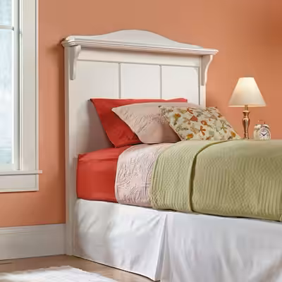 Add a touch of charm to your bedroom with this classic white twin-size headboard. With a clean panel...