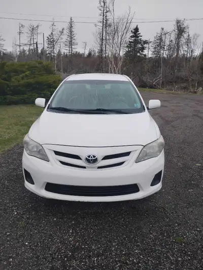 2011 Toyota Corolla. Won't start. Some rust and door sprung open on driver's side, leaving some dama...