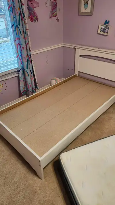 White wooden kids twin bed frame with solid chipboard base (not slats). Low profile, great for those...