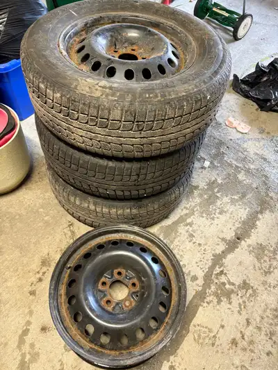 These are 3 used 235/65R17 Trek MZ winter tires mounted on steel rims, providing reliable traction d...