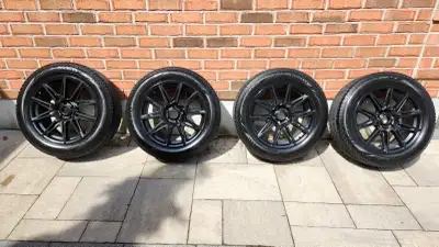 Set of Pirelli Ice Zero Asimmetrico winter tires (235/55R18) mounted on Fast Wheels Switch satin bla...