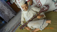 Doll unusual, clay musician with instrument, nice position,uniqu