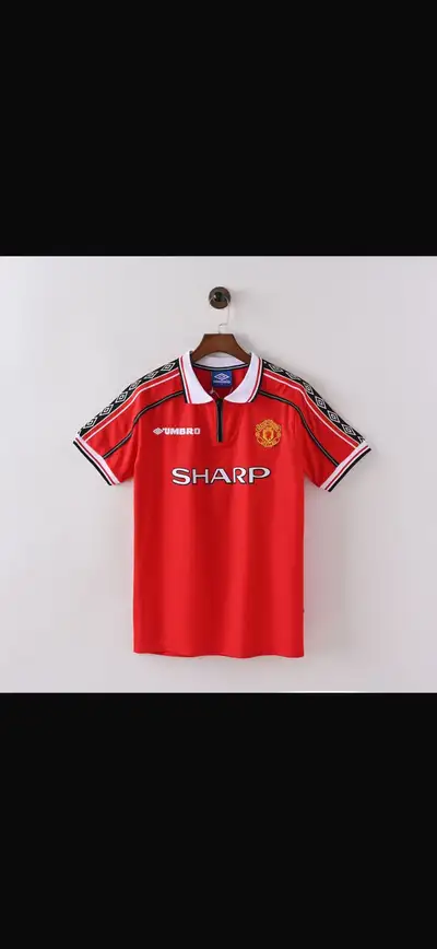 Get ready to relive the glory days with this vintage Umbro Manchester United 1998-1999 home soccer j...