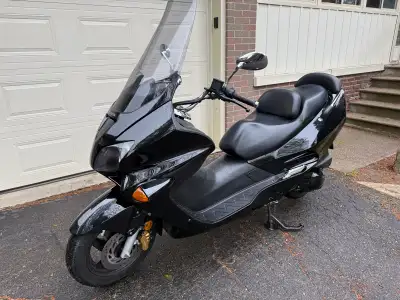 For sale is my Honda Reflex 2004 scooter, a reliable and stylish ride. Given its age, this scooter h...