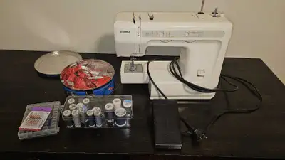 This Sears Kenmore sewing machine, model 385.81808, is ready to tackle your sewing projects with its...