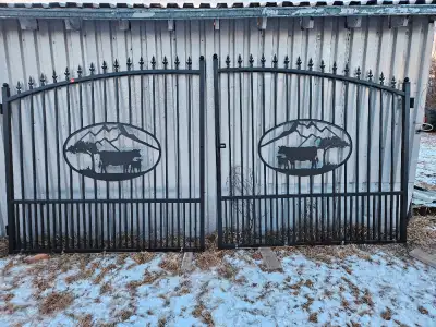 14 foot (2 7 footers) bi-parting gates. Wrought iron style, painted black galvanized steel with Catt...