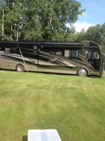 2004 American Eagle 40 foot Motorhome. Low kilometers, very clean, always stored. Onan generator. To...