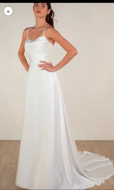 Selling my beautiful wedding dress that has never been worn, never altered, and is in brand-new cond...