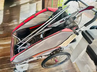 Double stroller with attachments.
