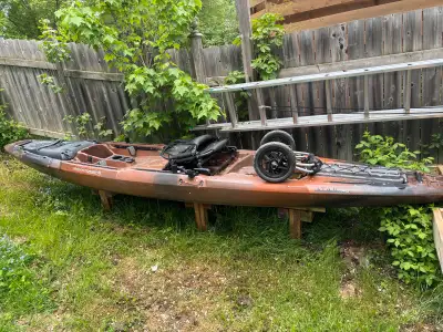 Solid and stable sit on top hunting and fishing Kayak, 14ft long. Two sets of paddles, cart for haul...