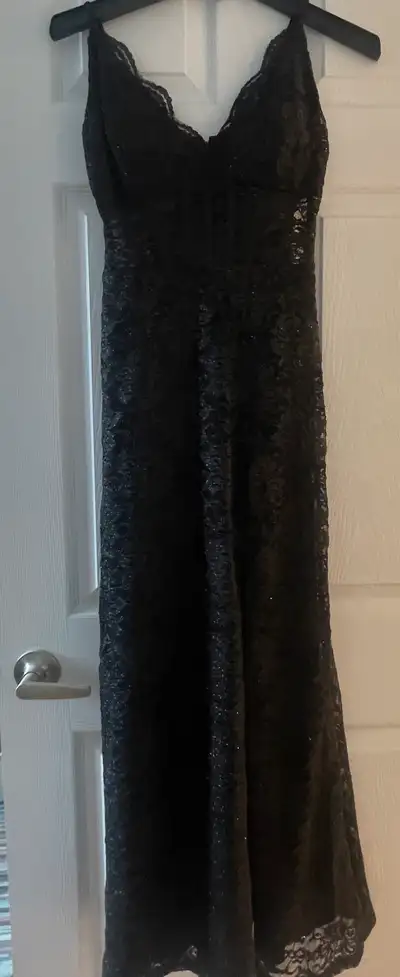 Black lace prom dress with slit on one side as you can see, size 0 , only worn a few hours. Always k...