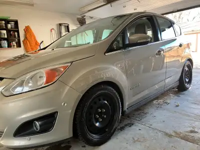 130,000km, hybrid with many options such as heated leather seats, auto parking option