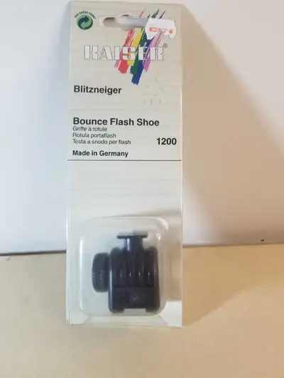 This is a new Kaiser Blitzneiger Bounce Flash Shoe, model 1200, made in Germany. It allows you to ea...