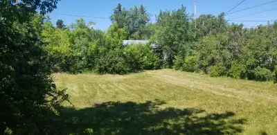 Large Corner Lot across from the high school. House on lot but needs demolition. Taxes paid for 2026...