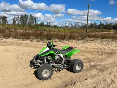 Bike is a 2010 kfx 450 , it has upgraded cams , FmF pipe , reverse works , clutch is still great it...