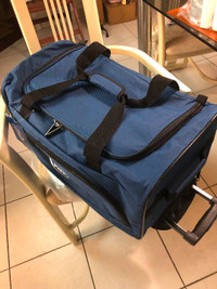 TRAVEL BAG  BRAND NEW WITH PULL-OUT HANDLE.CAN BE A CARRY-ON BAG