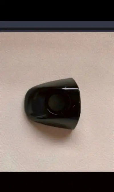 This black exterior door handle cover is in used condition. It would make a good replacement part fo...