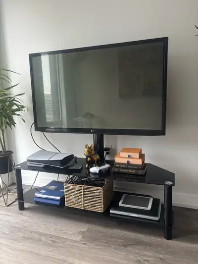 55” lg tv (not a smart tv) and glass tv stand , View more
