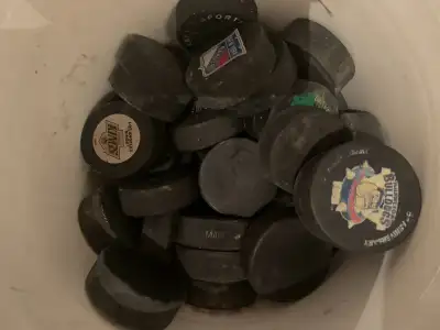 40 Used Hockey Pucks, View more