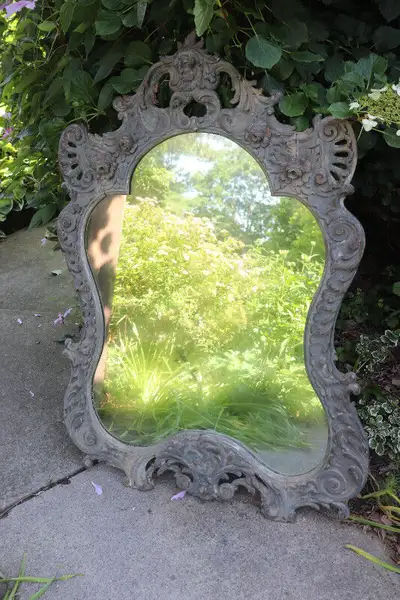 Hi. I have an old ornate framed large mirror for sale. The frame is all carved wood. It shows some w...