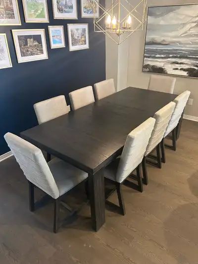 Ashley furniture dark brown woodgrain dining room table (with leaf - insert included). Pictured: One...