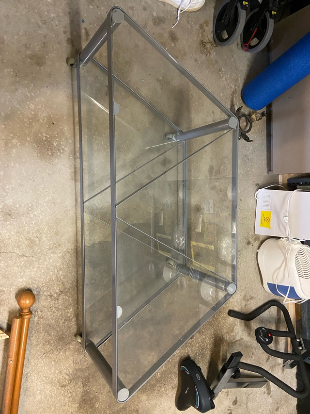 Glass table with wheels - $40 in TV Tables & Entertainment Units in Calgary