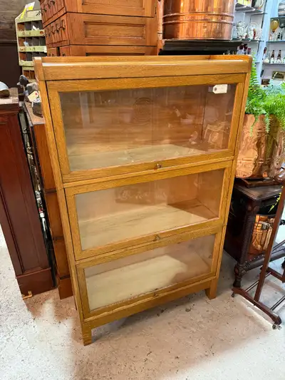 Really nice solid oak barrister bookcase. 3 tier plus legs and top Dimensions are in the photos $795...