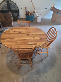 90's era small kitchen table with 3 chaira