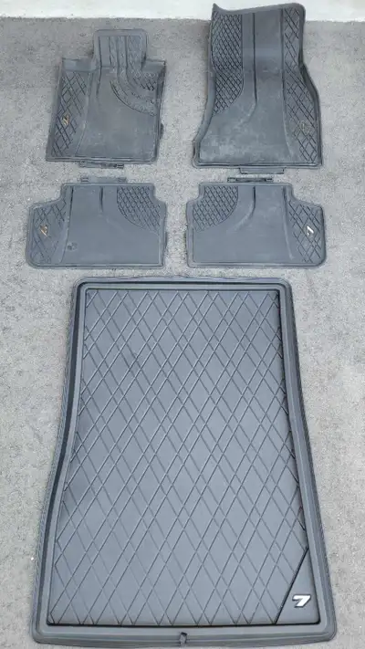These are used floor mats and trunk liner designed for a BMW 7 series (used on a 2016 750ix), provid...