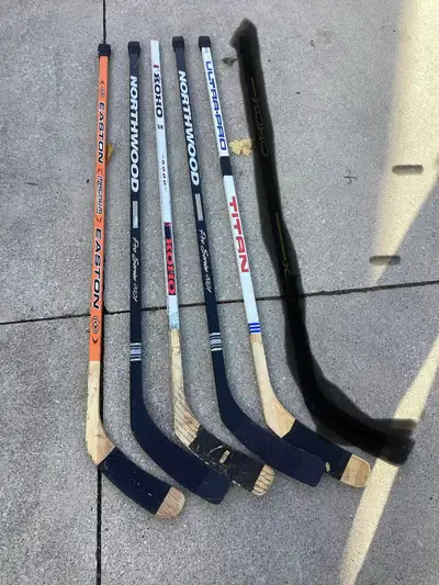 11 Used Wood Hockey Sticks, View more