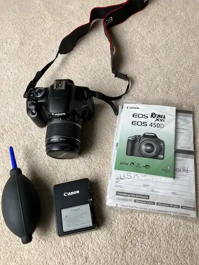DSLR Camera: Canon Rebel EOS XSi 450D with accessories and bag, View more