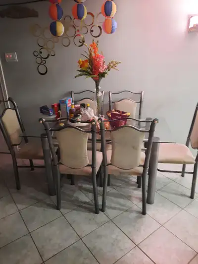 Glass dining table with 6 metal chairs, View more