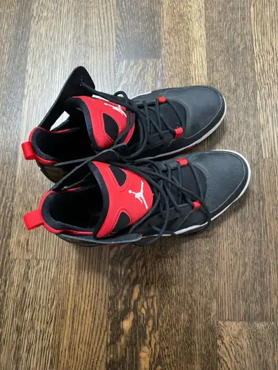 Get ready to elevate your game with these Jordan shoes! Sporting a sleek black, white, and red colou...