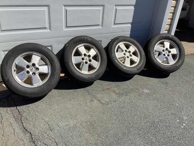For sale: Four 225 65 16 all season tires on Escape rims in Tires & Rims in Annapolis Valley
