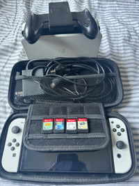 OLED Nintendo switch with 4 games/carrying case