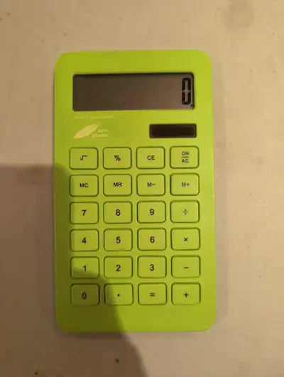 This is a green, 10-digit calculator, perfect for everyday calculations.